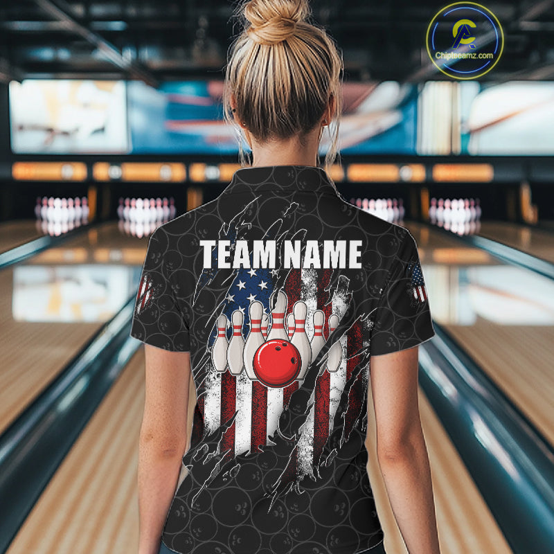 Back view of woman wearing a vintage American flag black bowling polo shirt inside a bowling alley.