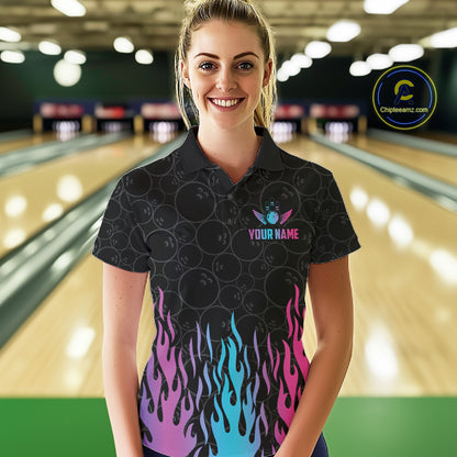 Woman wearing a fire flame neon bowling polo shirt at a bowling alley front view.