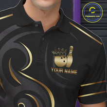 Load image into Gallery viewer, Close-up of a black and gold crown bowling ball polo shirt collar, buttons, and crown artwork.