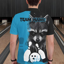 Load image into Gallery viewer, Back view of man wearing a black and blue raccoon bowling polo shirt inside a bowling alley.