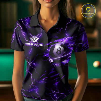 Woman wearing a purple thunder lightning billiard jersey beside a pool table front view.