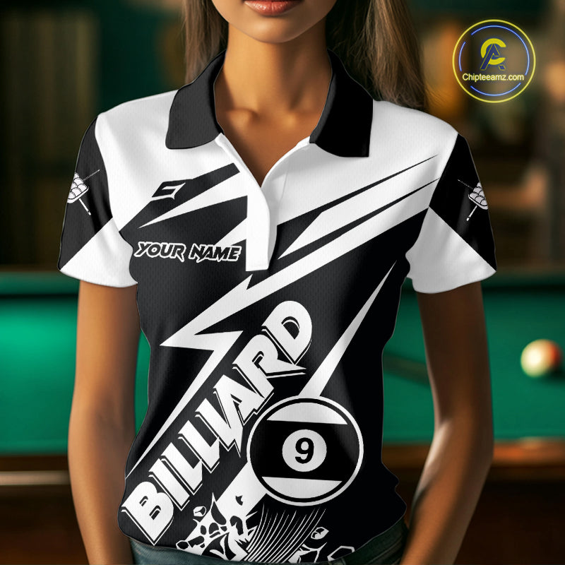 Woman wearing a funny black and white 9 ball billiard jersey beside a pool table front view.