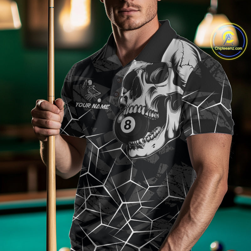Man wearing a black and white skull billiard jersey beside a pool table front view.