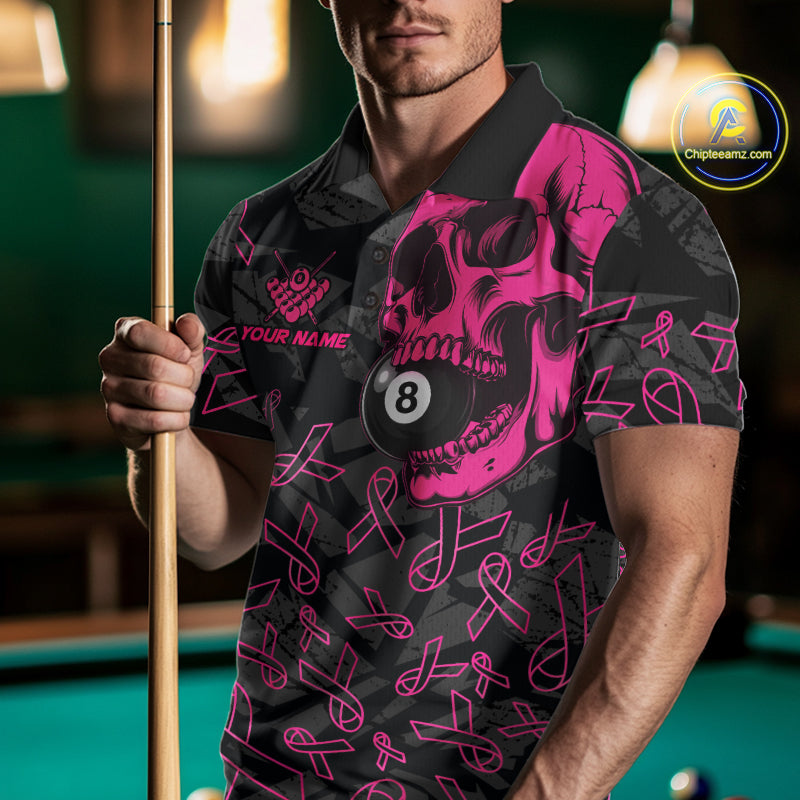 Man wearing a pink ribbon skull billiard jersey beside a pool table front view.