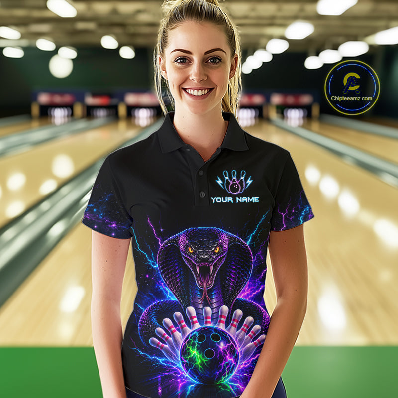 Woman wearing a neon cobra bowling polo shirt at a bowling alley front view.