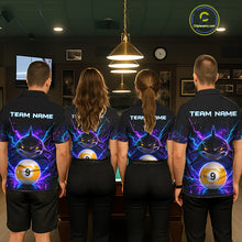 Load image into Gallery viewer, Back view of pool players wearing matching neon shark billiard shirts in a game room.