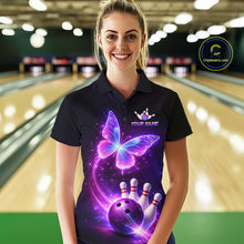 Load image into Gallery viewer, Woman wearing a black bowling shirt with a colorful butterfly design in a bowling alley.