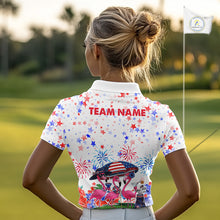 Load image into Gallery viewer, Female golfer wearing patriotic flamingo golf polo during Independence Day golf event, premium golf apparel for patriotic golfers and tropical fashion enthusiasts.