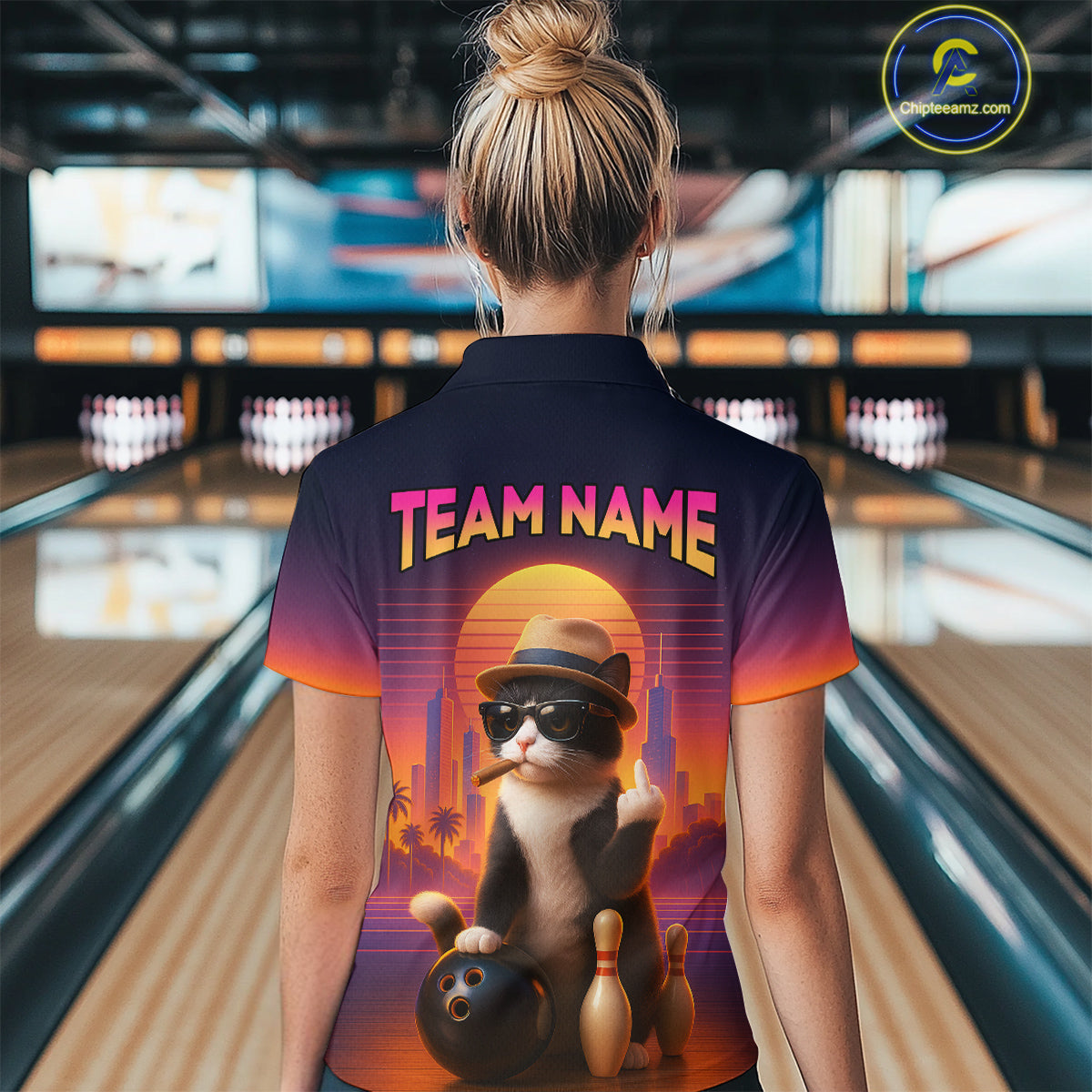 Women’s retro funny cat bowling quarter zip shirt, back view on female model in bowling lane 